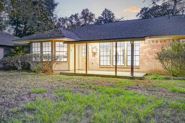 a view of a house with garden and yard