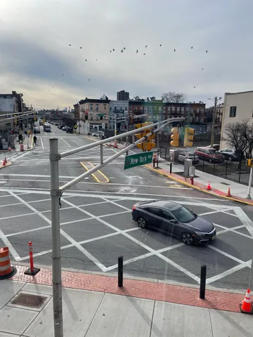 a outdoor space with lots of cars and parked cars