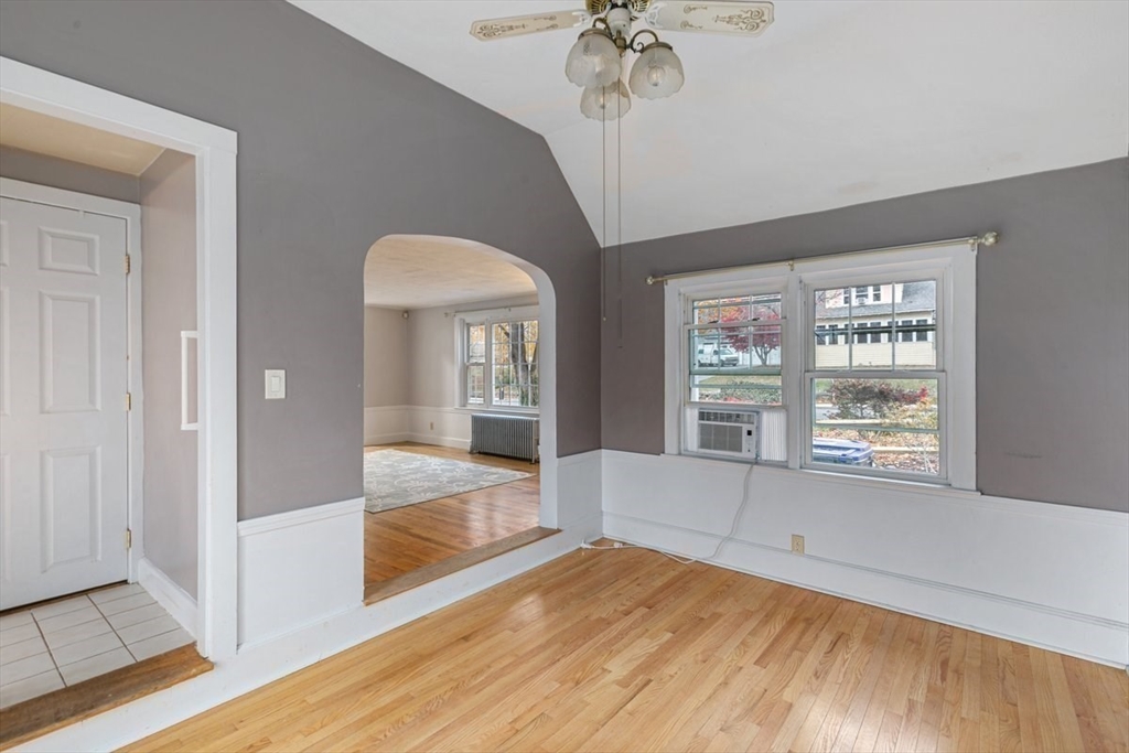 220 Pelham Street Methuen, MA 01844 - Photo 12 of 19 a view of an empty room with a window and wooden floor