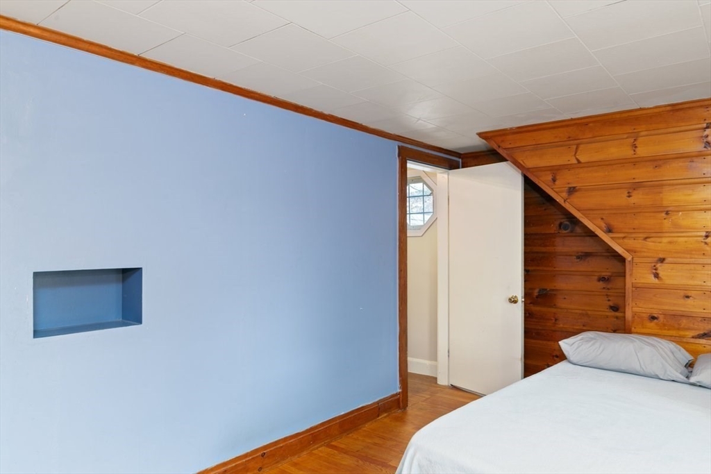 220 Pelham Street Methuen, MA 01844 - Photo 16 of 19 a bedroom with a bed and a wall painting