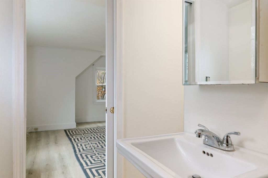 220 Pelham Street Methuen, MA 01844 - Photo 7 of 19 a bathroom with a sink and mirror