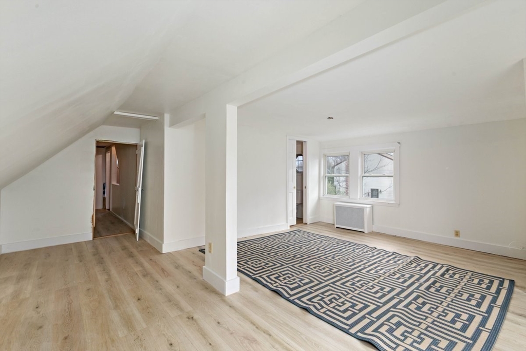 220 Pelham Street Methuen, MA 01844 - Photo 9 of 19 wooden floor in an empty room with a window