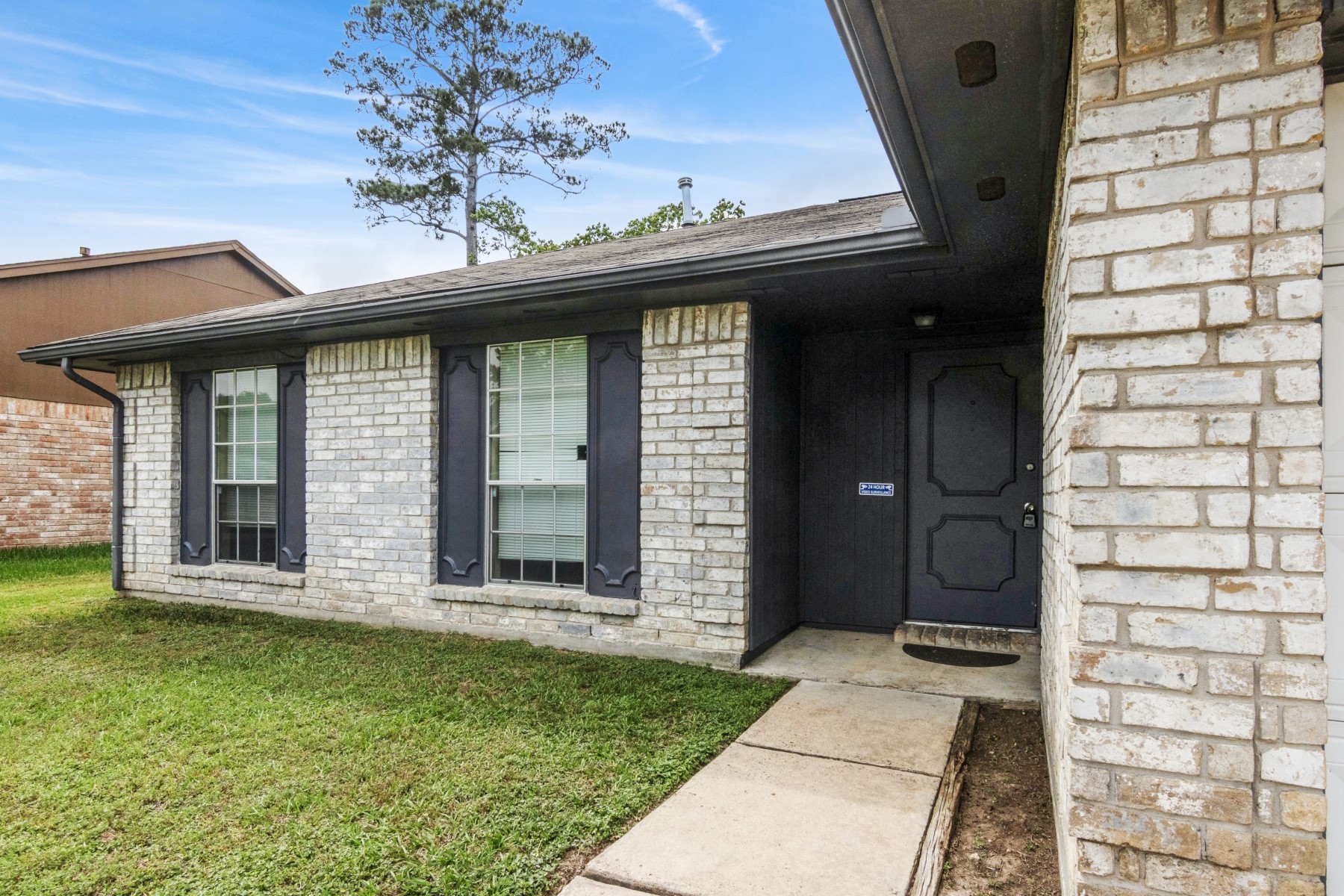 2531 North Spring Drive Spring, TX 77373 - Photo 3 of 24 a front view of a house with a garden
