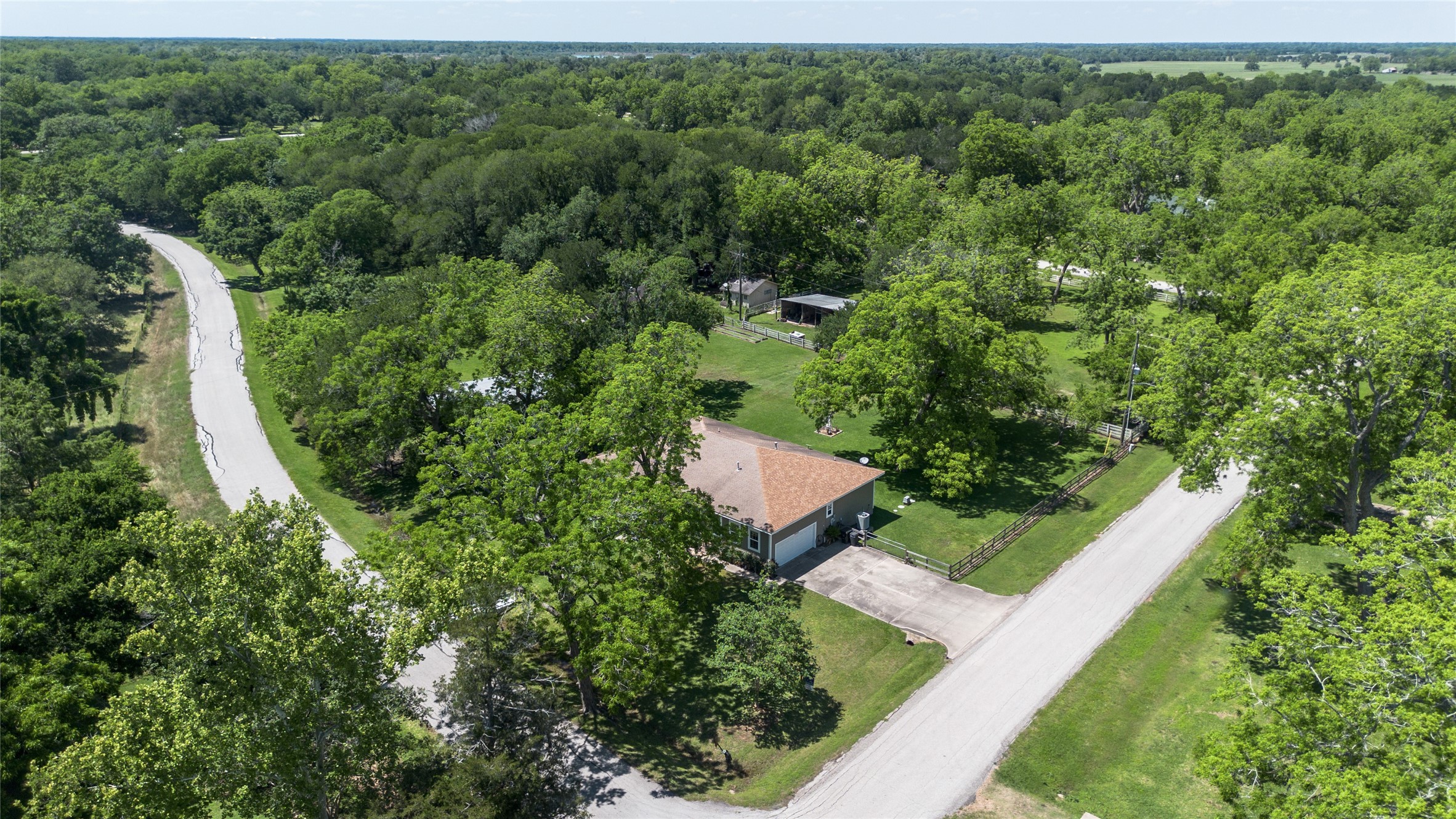 36606 Tejas Road Simonton, TX 77485 - Photo 2 of 35 an aerial view of a house with a yard