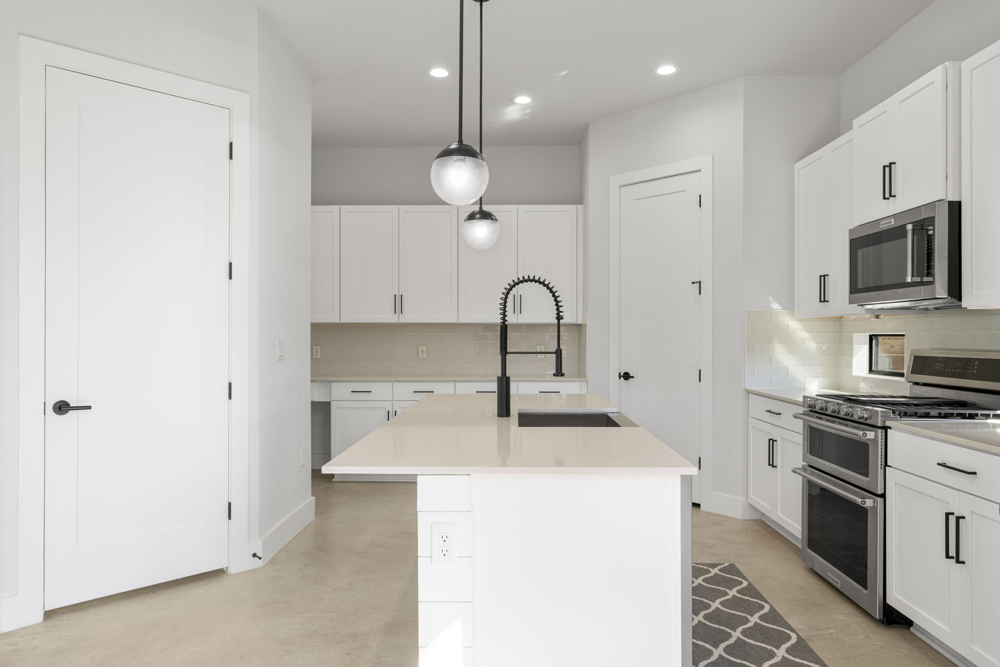 1405 Perez Street, Unit 1 Austin, TX 78721 - Photo 13 of 31 a kitchen with a sink stainless steel appliances and cabinets