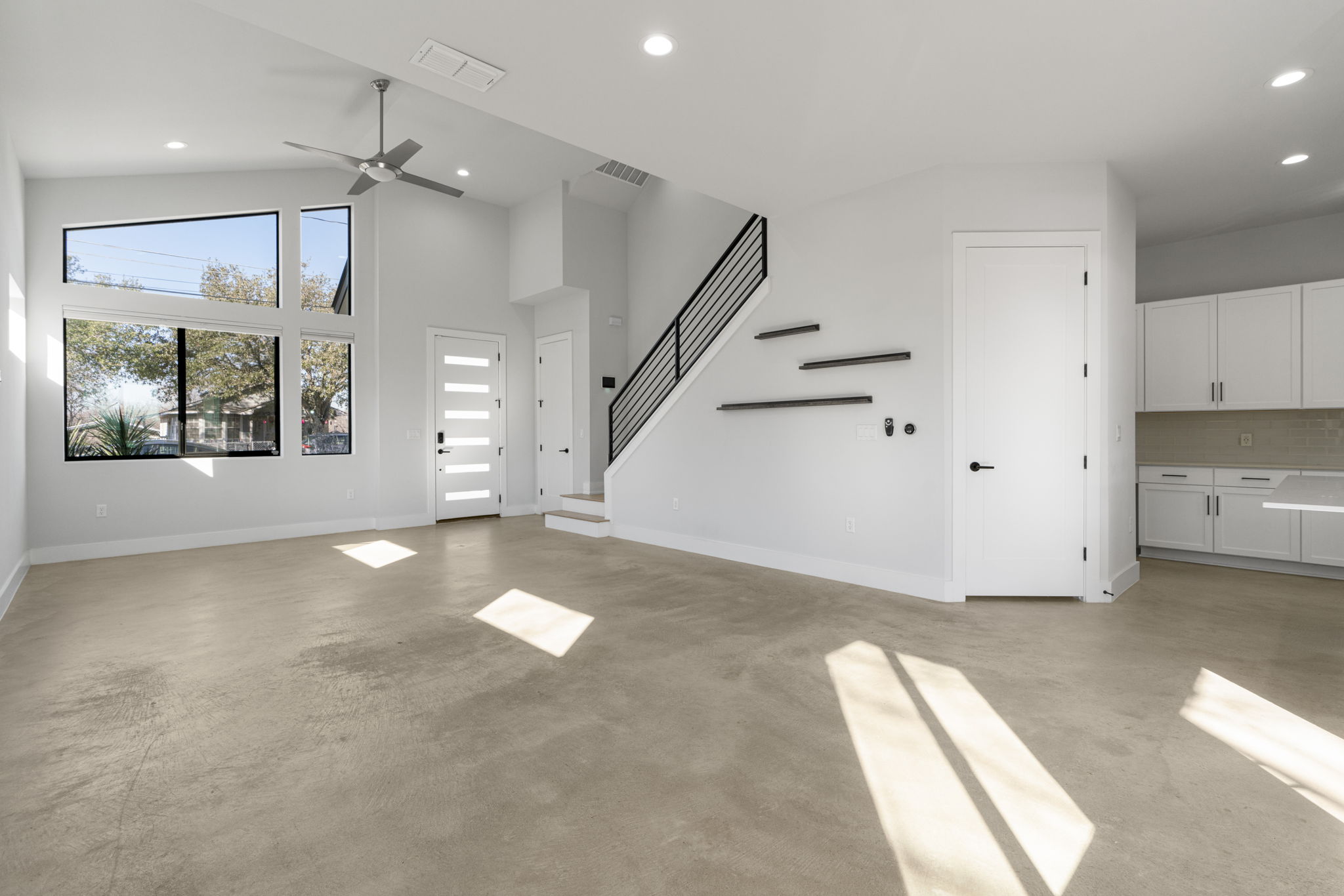1405 Perez Street, Unit 1 Austin, TX 78721 - Photo 5 of 31 a view of a big room with entryway kitchen view and windows