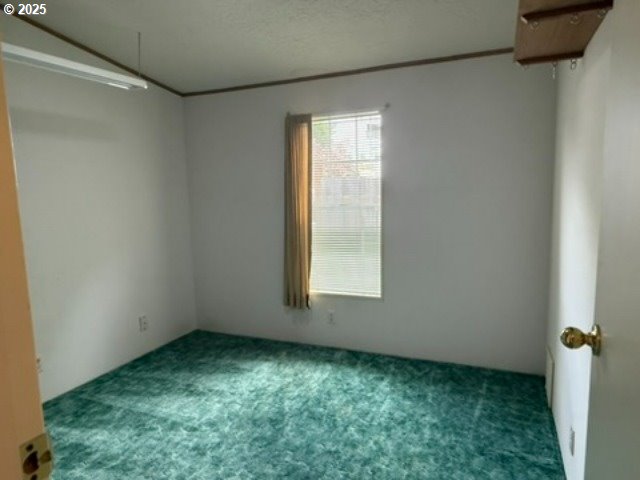 1401 West Ellendale Avenue, Unit 9 Dallas, OR 97338 - Photo 11 of 34 an empty room with a window