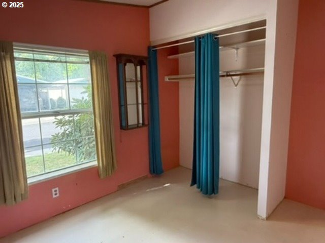 1401 West Ellendale Avenue, Unit 9 Dallas, OR 97338 - Photo 13 of 34 an empty room with windows and closet