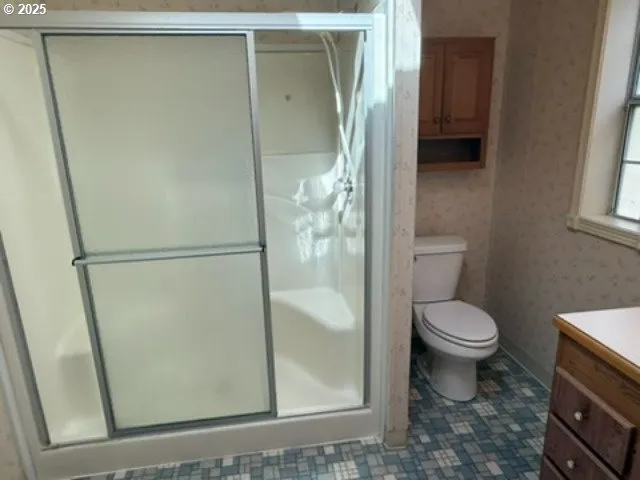 a backyard of a house with plants and outdoor seating