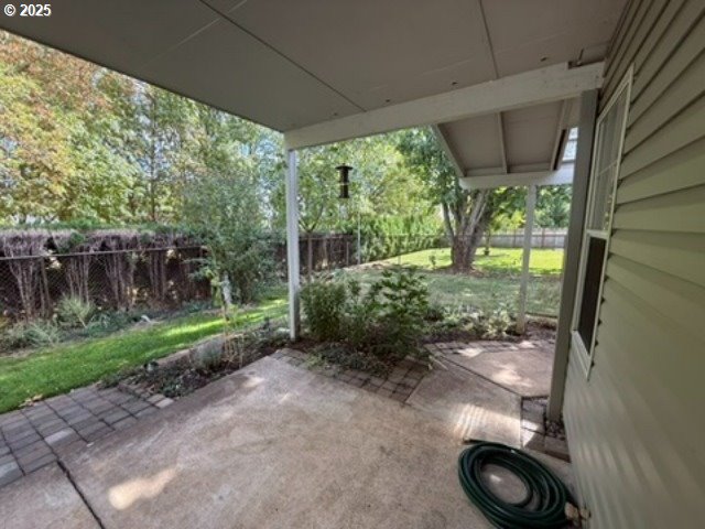1401 West Ellendale Avenue, Unit 9 Dallas, OR 97338 - Photo 30 of 34 a backyard of a house with plants and outdoor seating