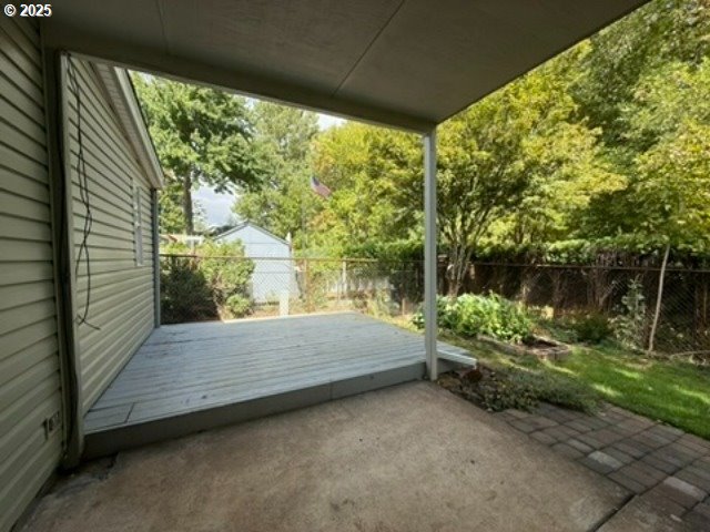 1401 West Ellendale Avenue, Unit 9 Dallas, OR 97338 - Photo 33 of 34 a wooden bench sitting in front of a building