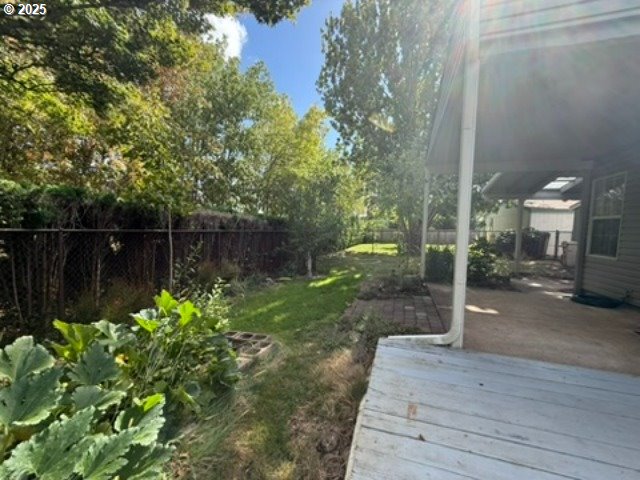 1401 West Ellendale Avenue, Unit 9 Dallas, OR 97338 - Photo 34 of 34 a backyard of a house with lots of green space