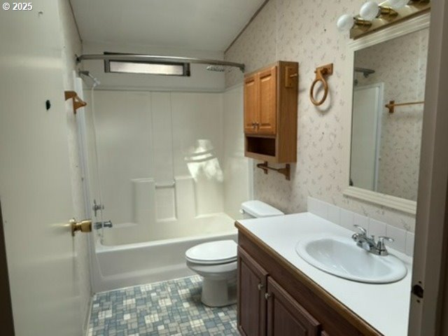 1401 West Ellendale Avenue, Unit 9 Dallas, OR 97338 - Photo 10 of 34 a bathroom with a sink a toilet and shower
