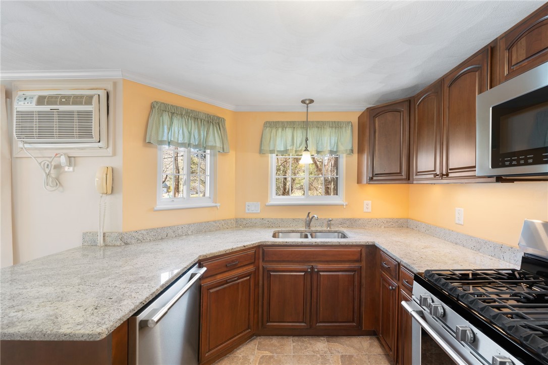 22 Eagle Run, Unit A Warwick, RI 02818 - Photo 16 of 34 Granite and stainless steel kitchen