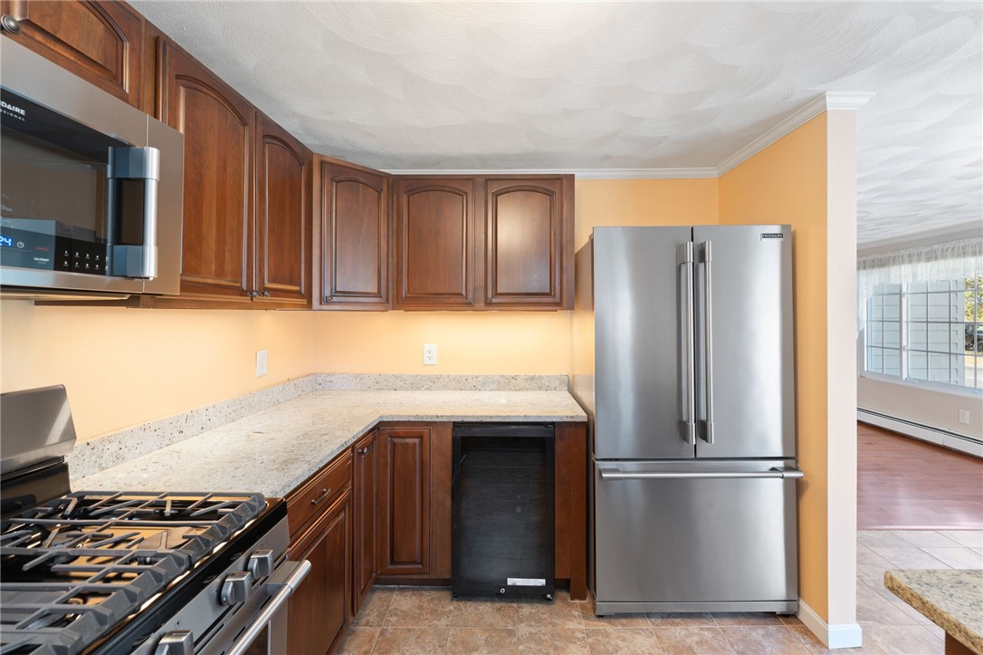 22 Eagle Run, Unit A Warwick, RI 02818 - Photo 17 of 34 Who doesn't love a built in beverage fridge