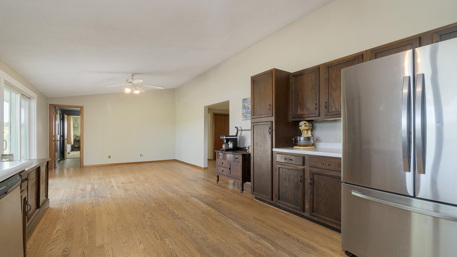 9807 North Leaf River Road Leaf River, IL 61047 - Photo 13 of 37 a kitchen with stainless steel appliances granite countertop a refrigerator and a stove top oven