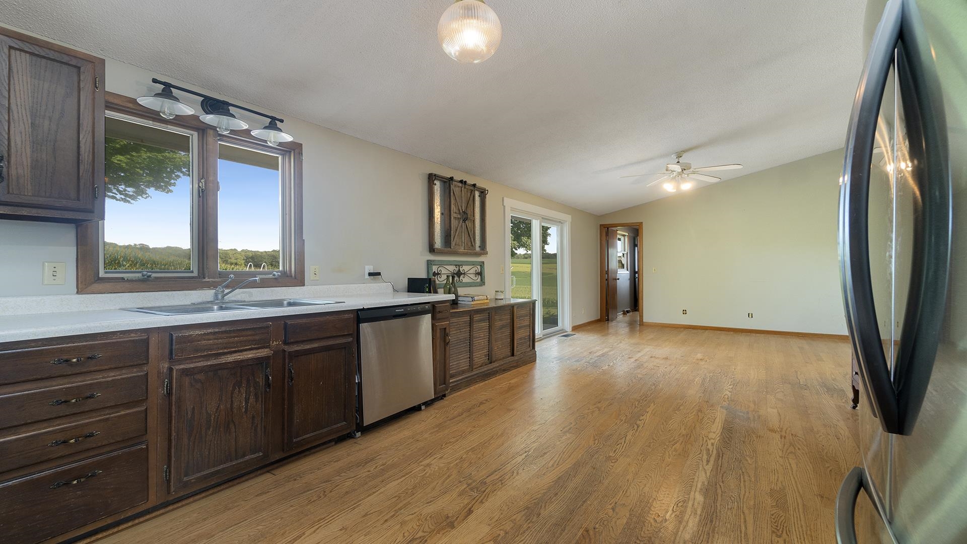 9807 North Leaf River Road Leaf River, IL 61047 - Photo 14 of 37 a large kitchen with granite countertop a large counter top space and stainless steel appliances