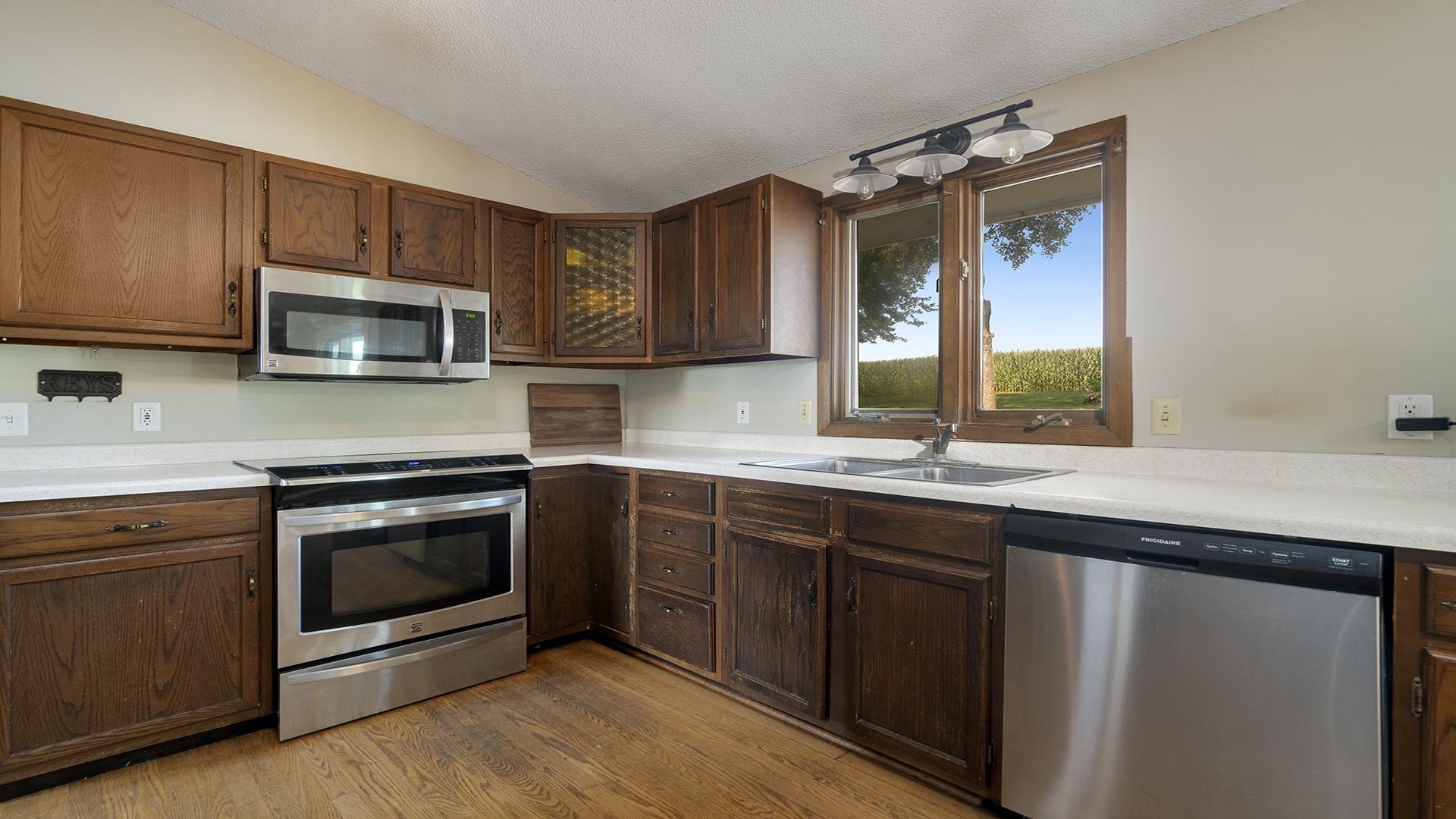 9807 North Leaf River Road Leaf River, IL 61047 - Photo 15 of 37 a kitchen with granite countertop a sink and steel appliances