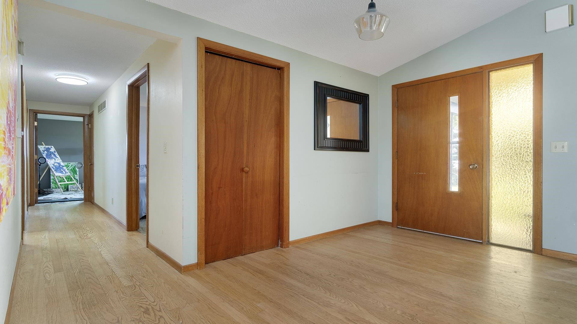 9807 North Leaf River Road Leaf River, IL 61047 - Photo 16 of 37 a view of hallway with livingroom and wooden floor