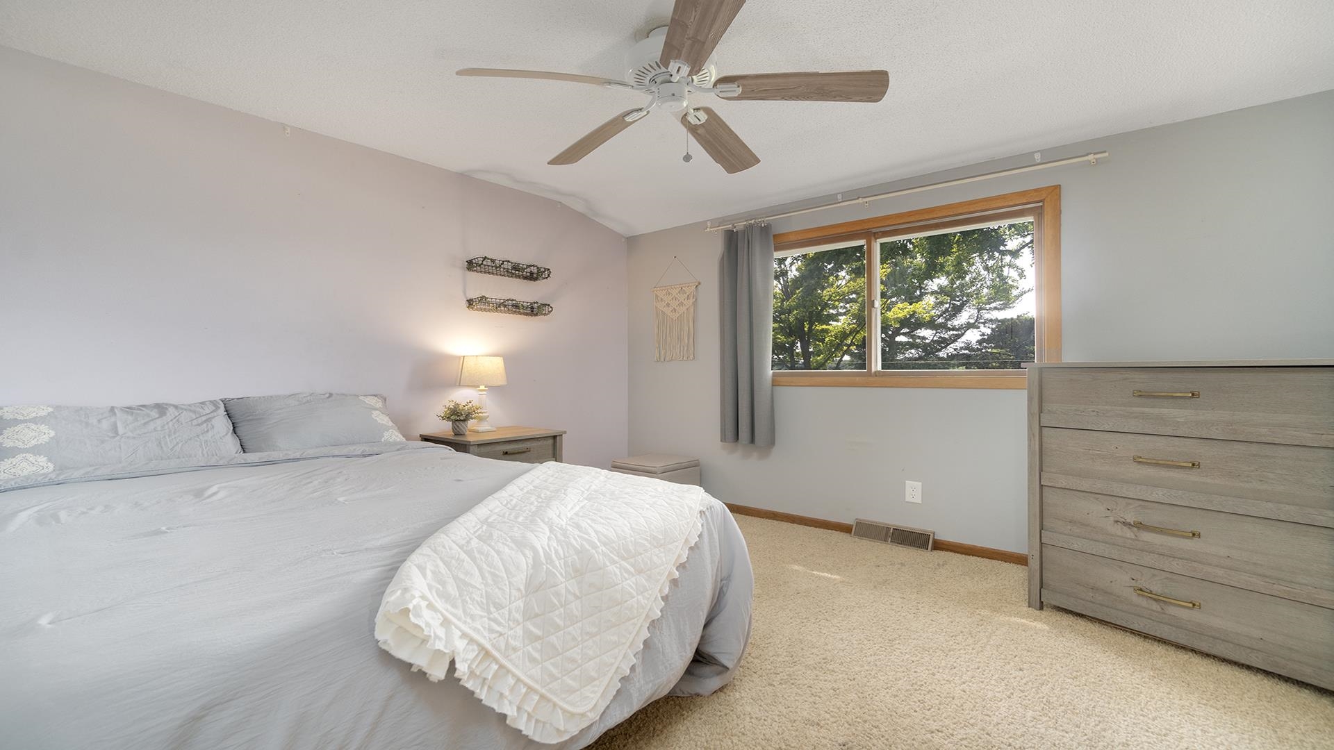 9807 North Leaf River Road Leaf River, IL 61047 - Photo 17 of 37 a bedroom with a bed and a dresser
