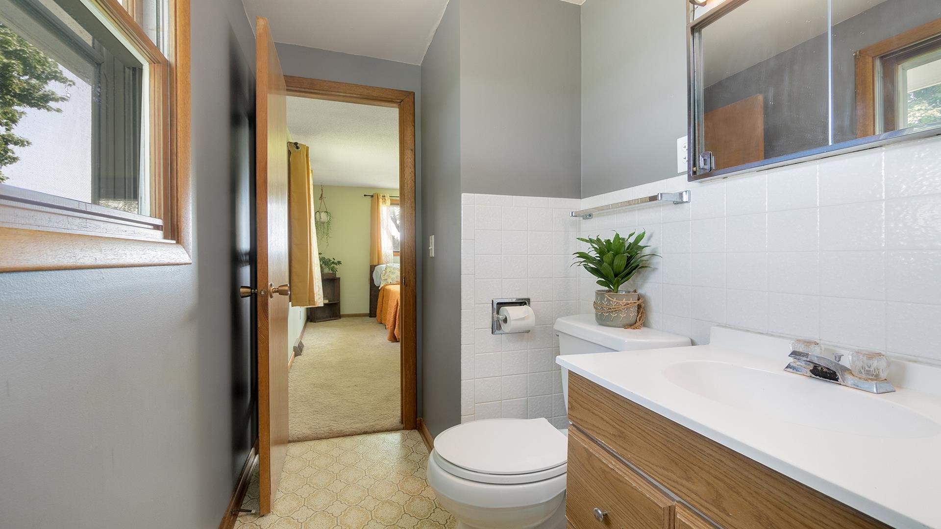 9807 North Leaf River Road Leaf River, IL 61047 - Photo 22 of 37 a bathroom with a sink a toilet and shower