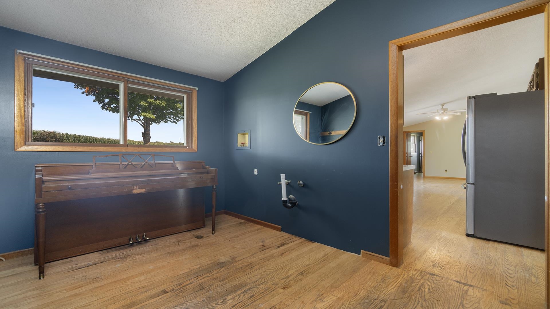 9807 North Leaf River Road Leaf River, IL 61047 - Photo 24 of 37 a bathroom with a sink a vanity and a mirror