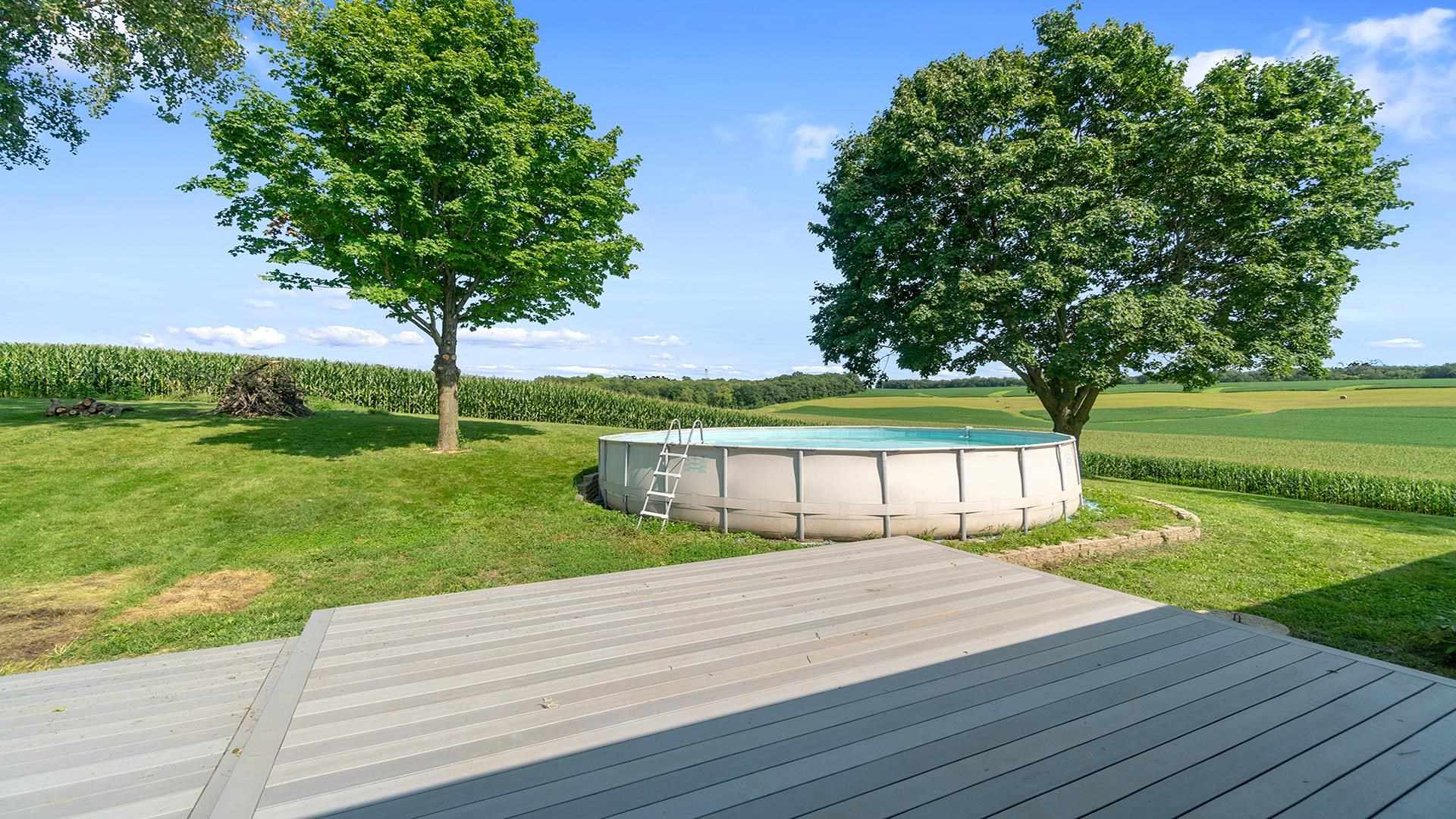 9807 North Leaf River Road Leaf River, IL 61047 - Photo 27 of 37 a balcony with wooden floor table and chairs