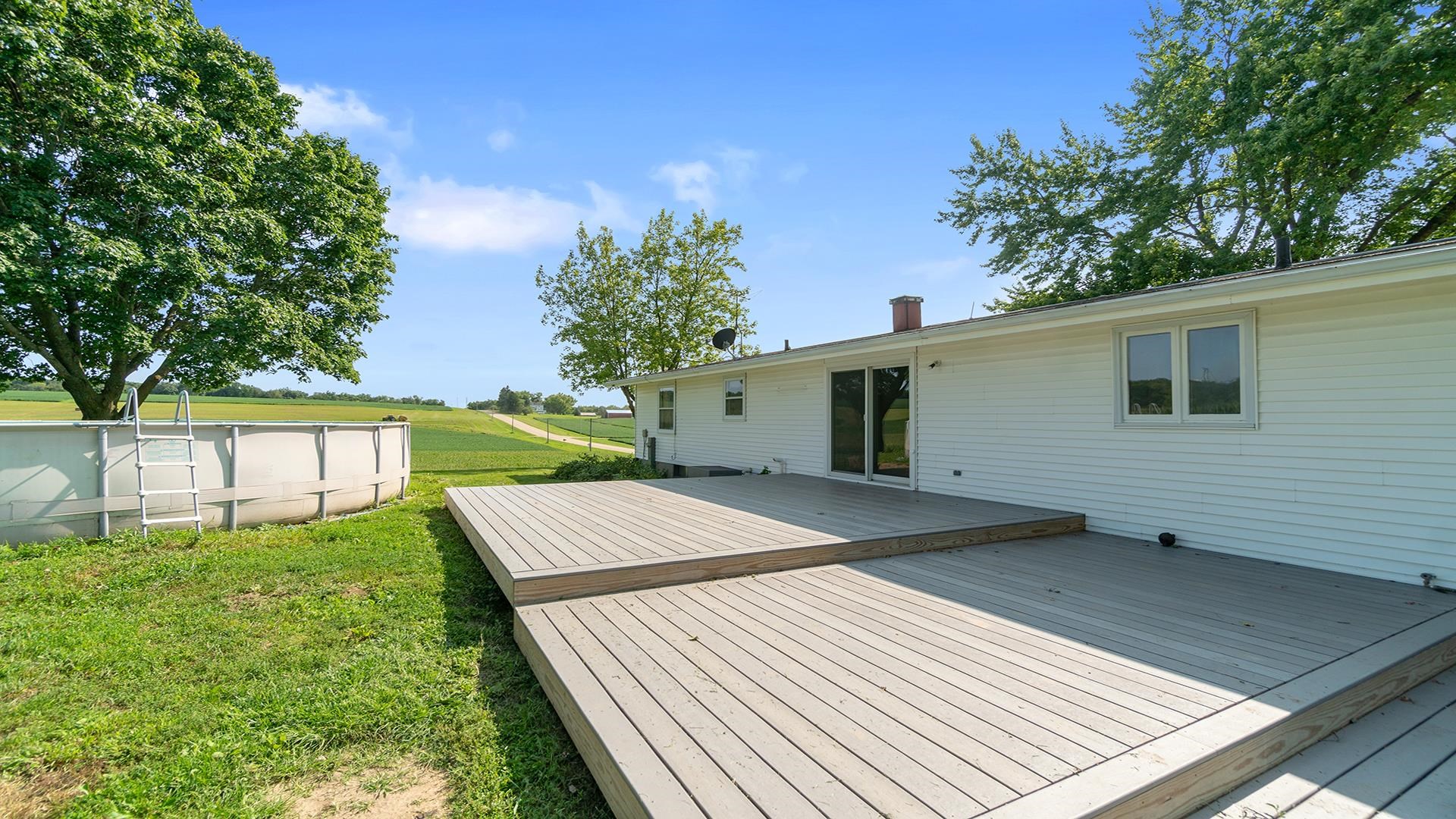 9807 North Leaf River Road Leaf River, IL 61047 - Photo 28 of 37 a view of a backyard with a large tree