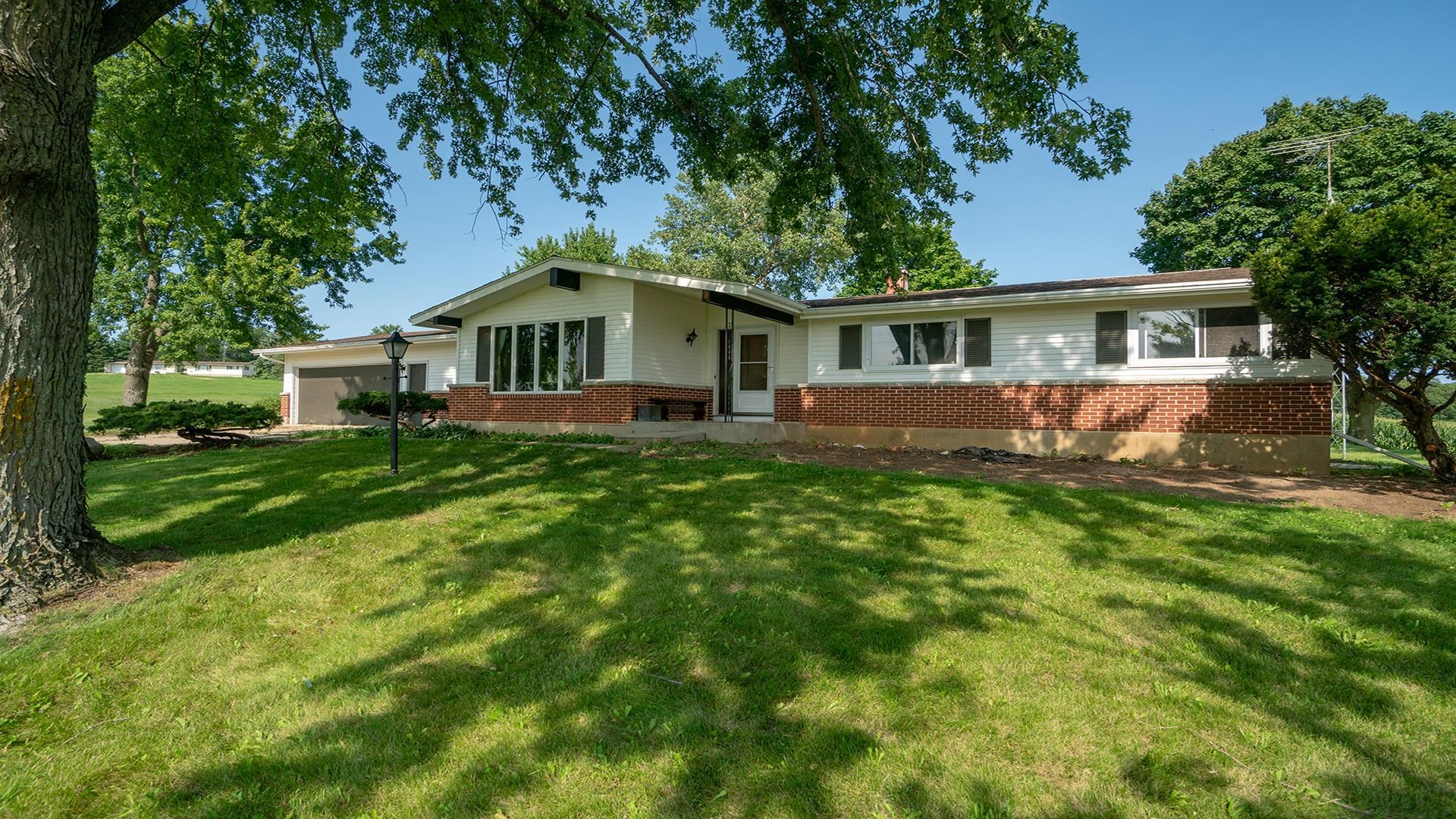 9807 North Leaf River Road Leaf River, IL 61047 - Photo 32 of 37 a front view of house with yard and green space