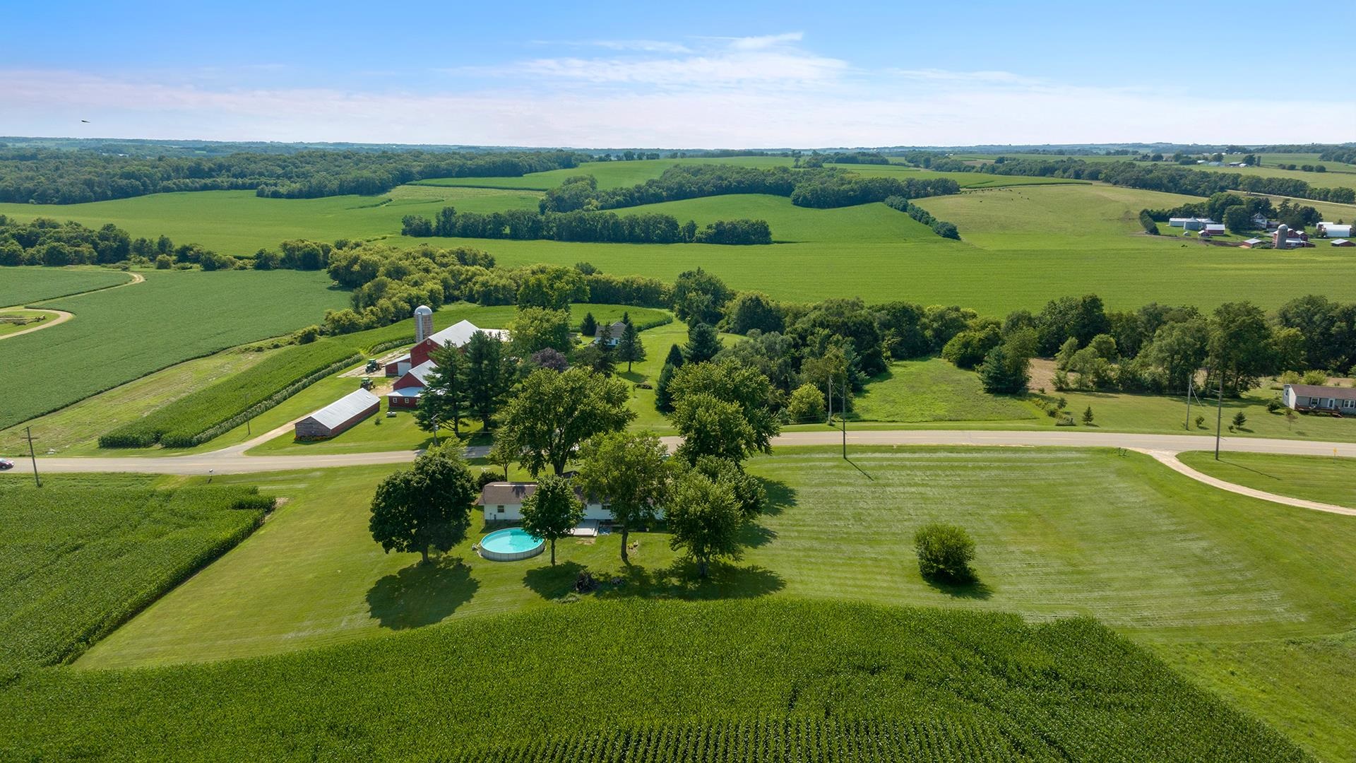 9807 North Leaf River Road Leaf River, IL 61047 - Photo 34 of 37 a view of a lake with a houses yard and lake view
