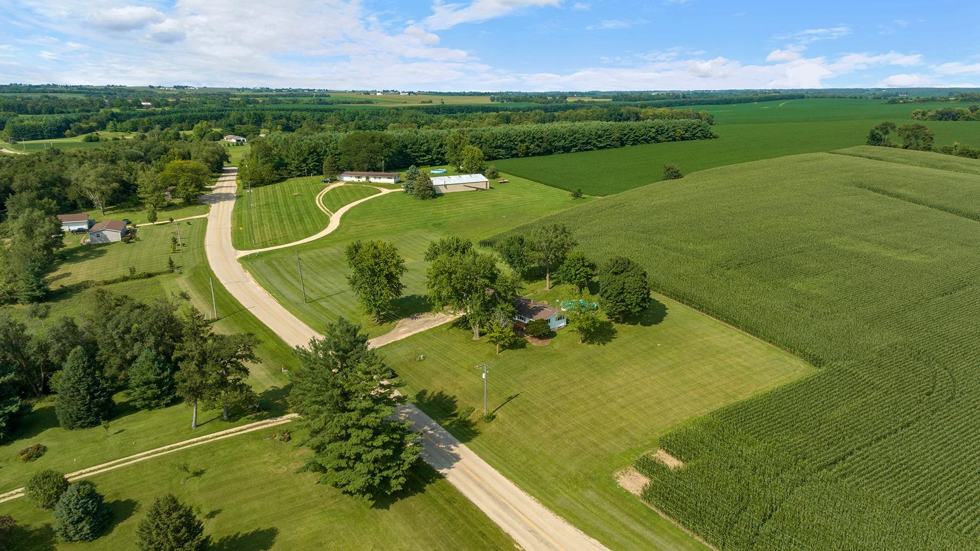 9807 North Leaf River Road Leaf River, IL 61047 - Photo 36 of 37 an aerial view of a golf course with a big yard