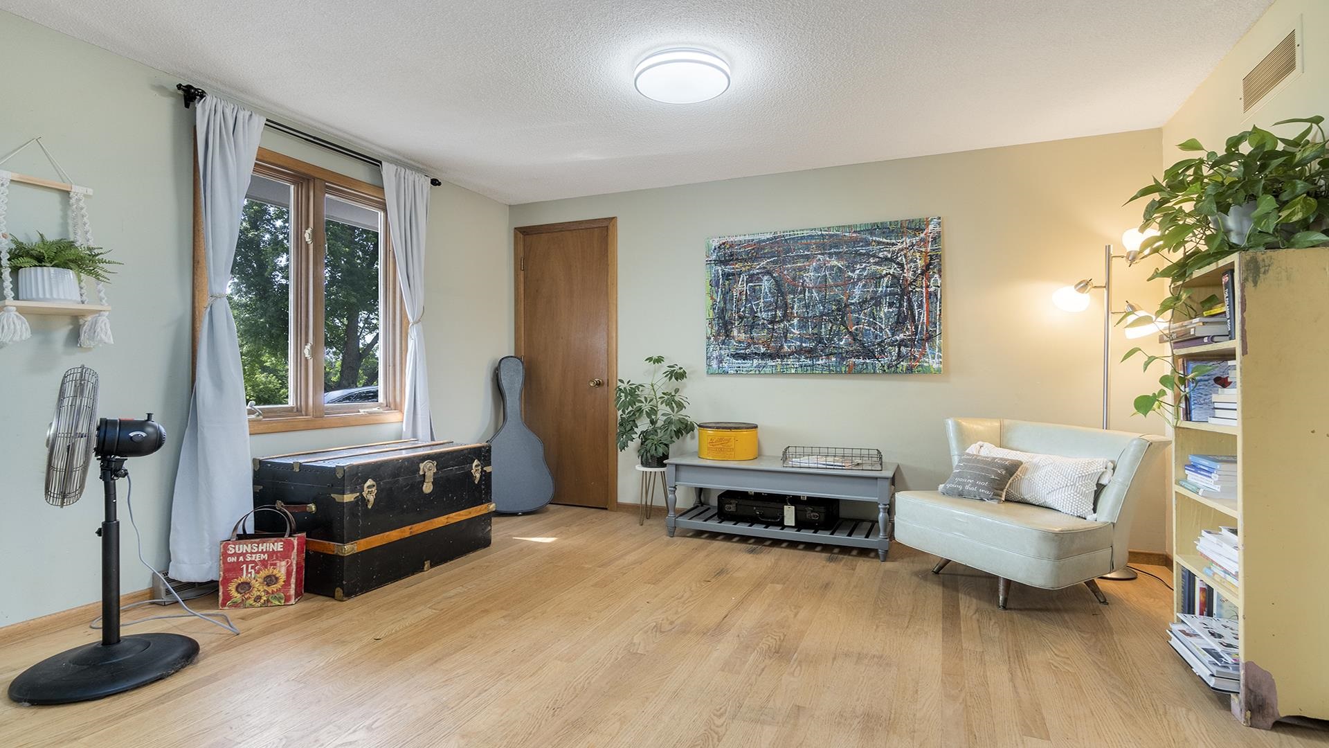9807 North Leaf River Road Leaf River, IL 61047 - Photo 8 of 37 a living room with furniture and a potted plant