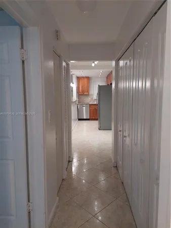 a bathroom with a granite countertop toilet sink and a mirror
