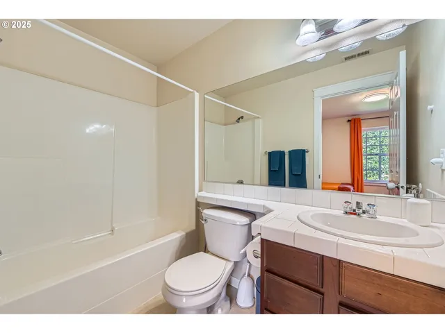 a view of a livingroom with furniture and a window