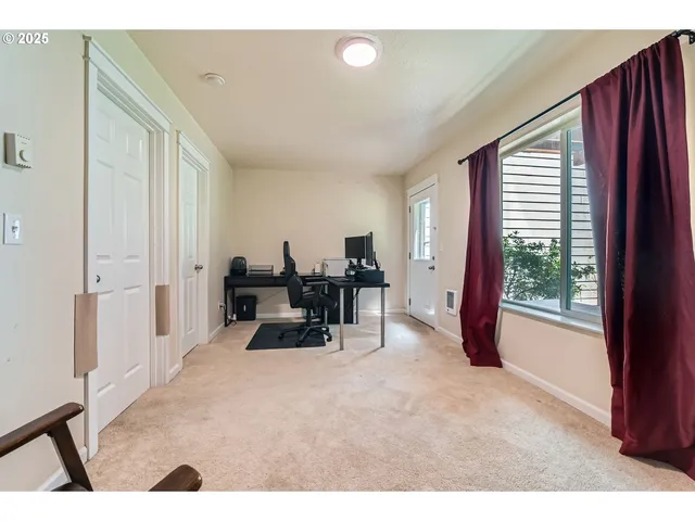 a bathroom with a sink a toilet a mirror and shower curtain