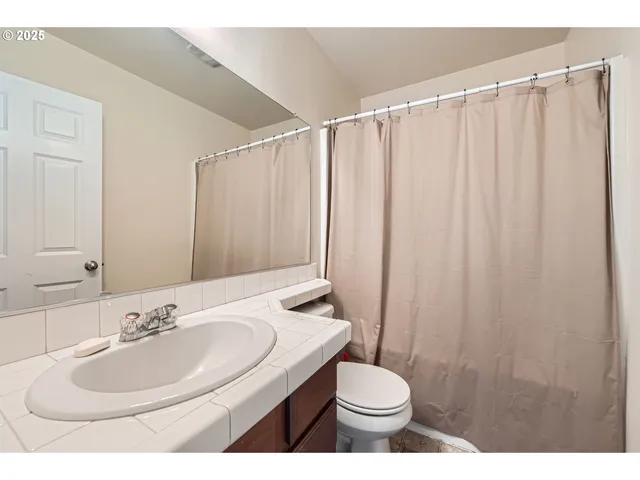 a view of a patio with table and chairs and potted plants