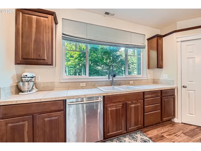 a kitchen with a sink and a window