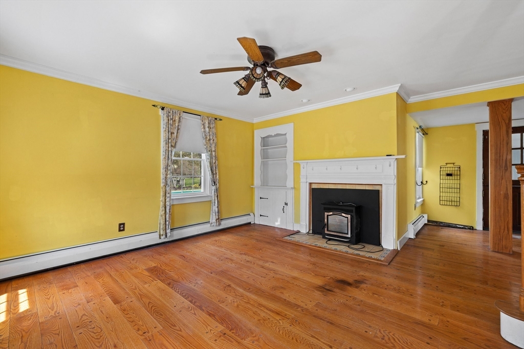 189 Fitchburg Road Ashburnham, MA 01430 - Photo 23 of 42 a view of an empty room with window and fireplace