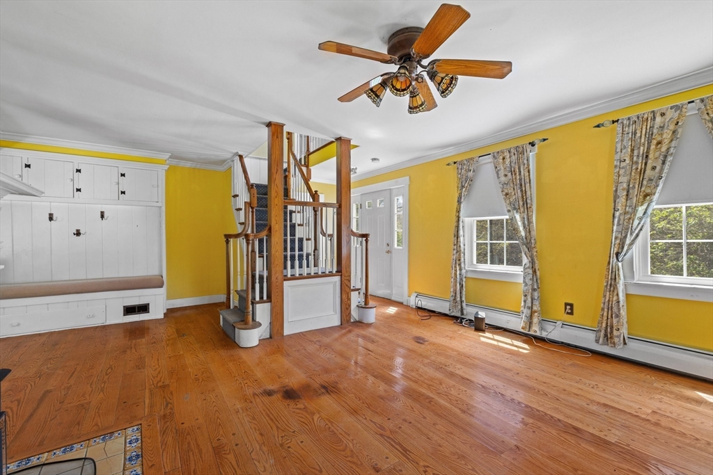 189 Fitchburg Road Ashburnham, MA 01430 - Photo 24 of 42 a view of a livingroom with wooden floor and a ceiling fan