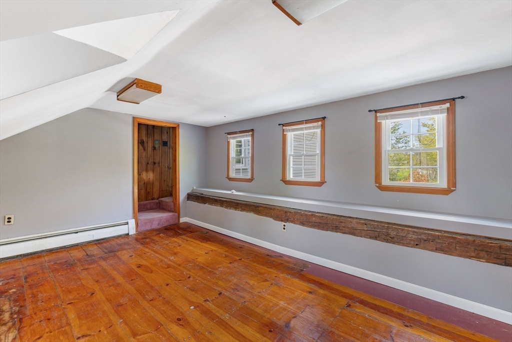 189 Fitchburg Road Ashburnham, MA 01430 - Photo 34 of 42 a view of an empty room with window and wooden floor