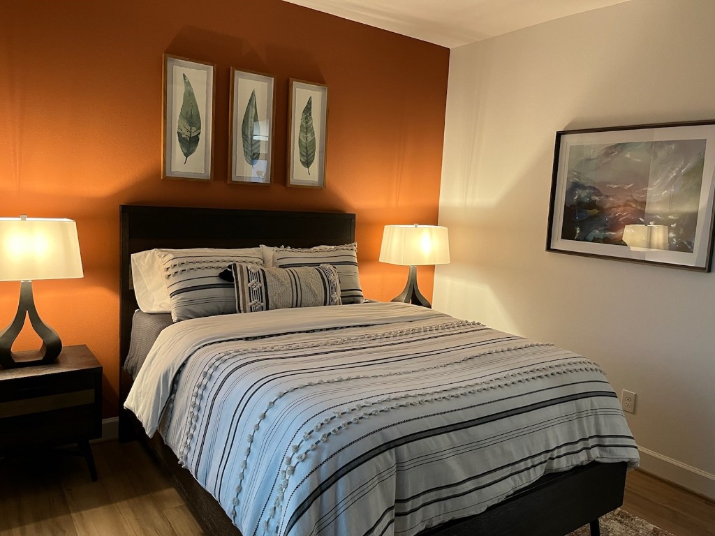 1817 Todville Road Seabrook, TX 77586 - Photo 16 of 27 a bedroom with a bed and lamps