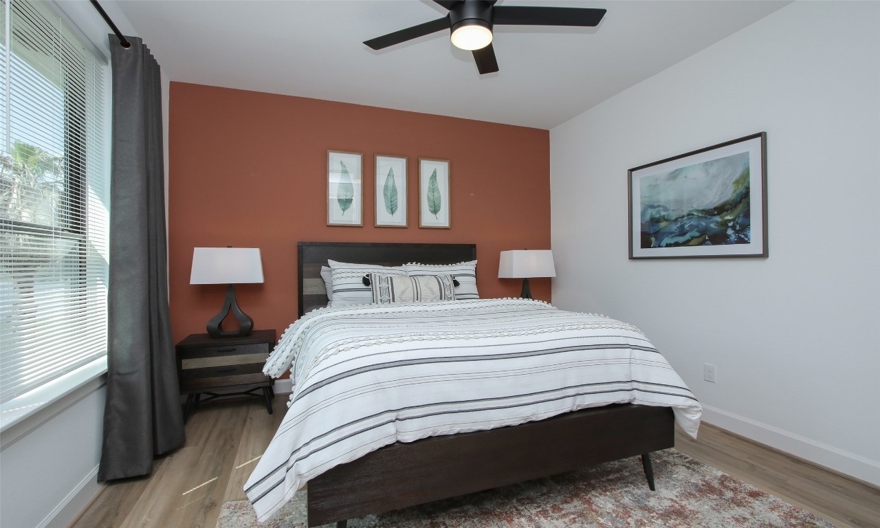 1817 Todville Road Seabrook, TX 77586 - Photo 17 of 27 a bedroom with a bed and a window