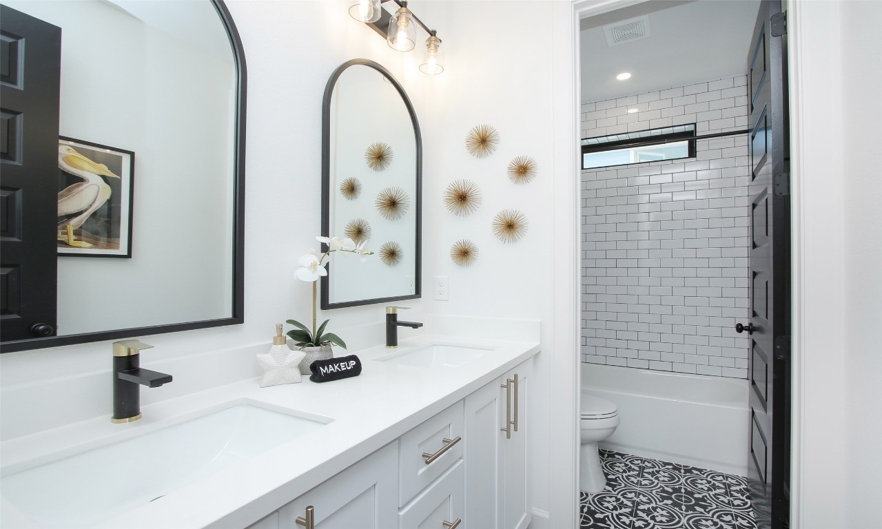 1817 Todville Road Seabrook, TX 77586 - Photo 19 of 27 a bathroom with a sink a toilet and shower