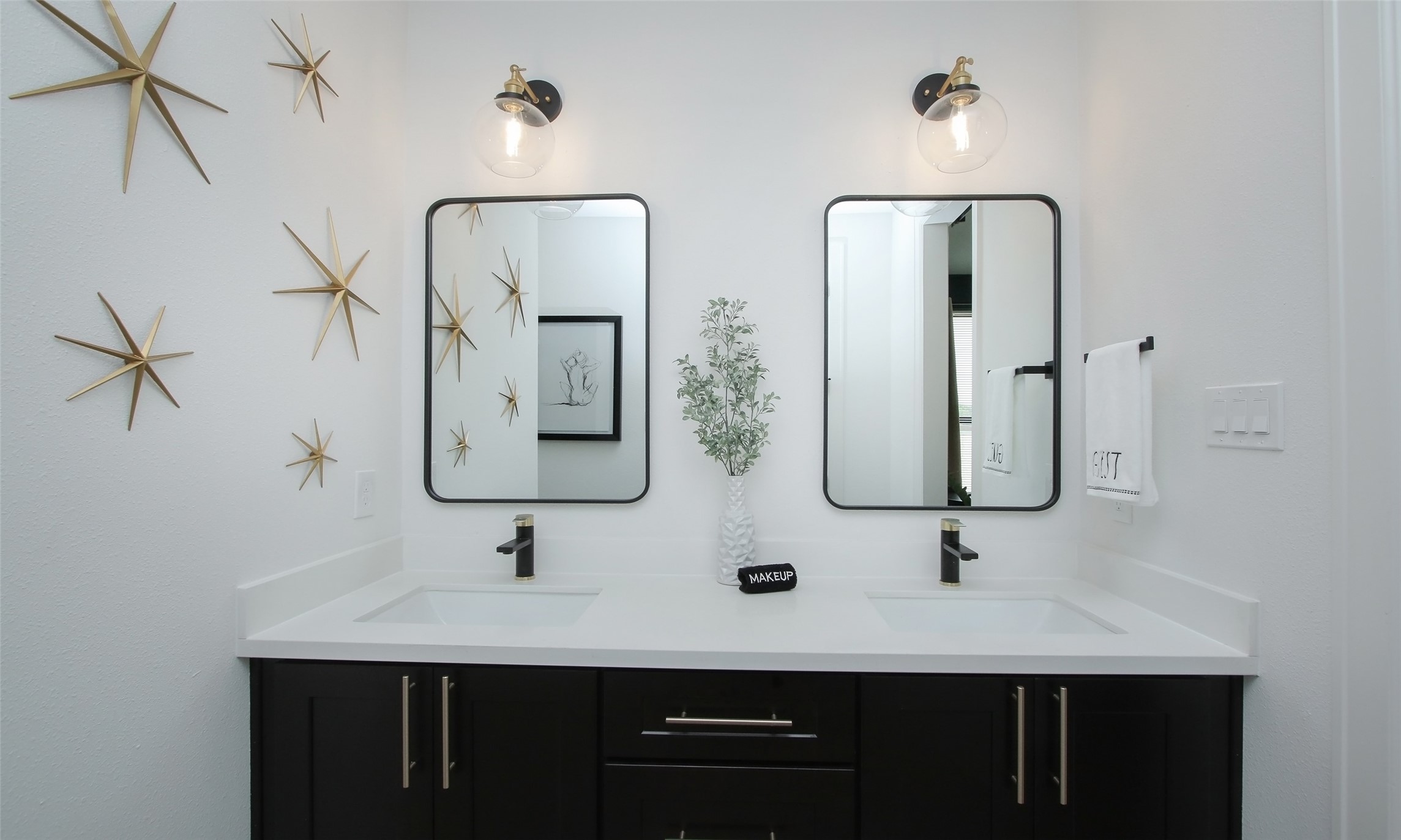 1817 Todville Road Seabrook, TX 77586 - Photo 8 of 27 a bathroom with double vanity sinks and a mirror
