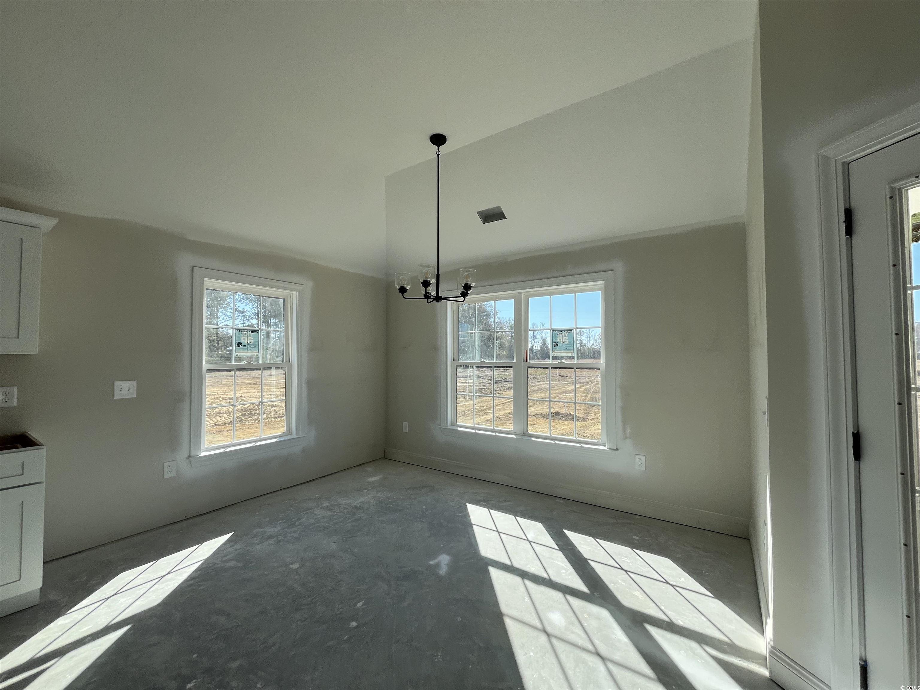 8193 Kerl Road Aynor, SC 29511 - Photo 6 of 11 Unfurnished dining area with a chandelier
