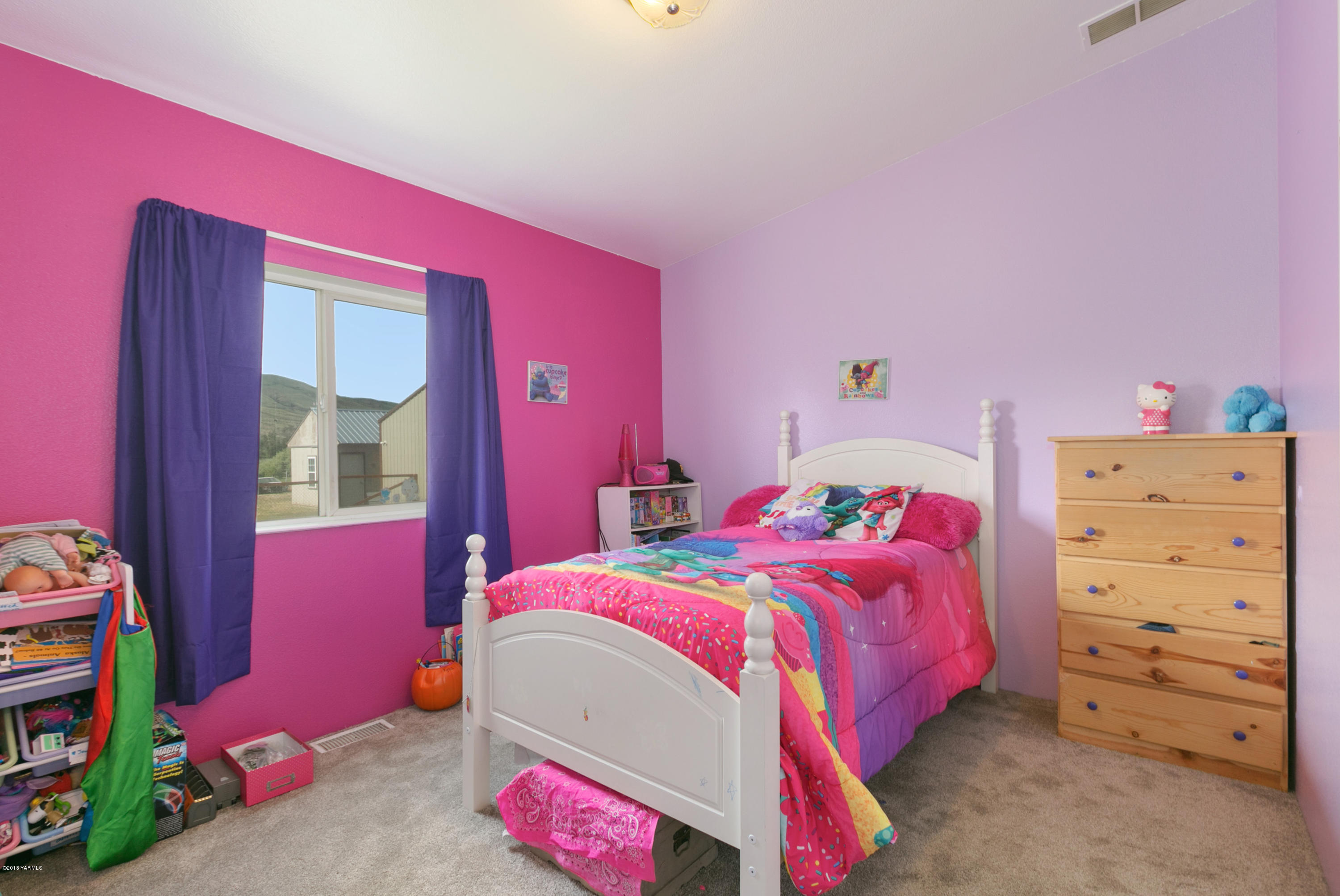 22490 Ahtanum Road Yakima, WA 98903 - Photo 12 of 20 a bedroom with a bed and a dresser
