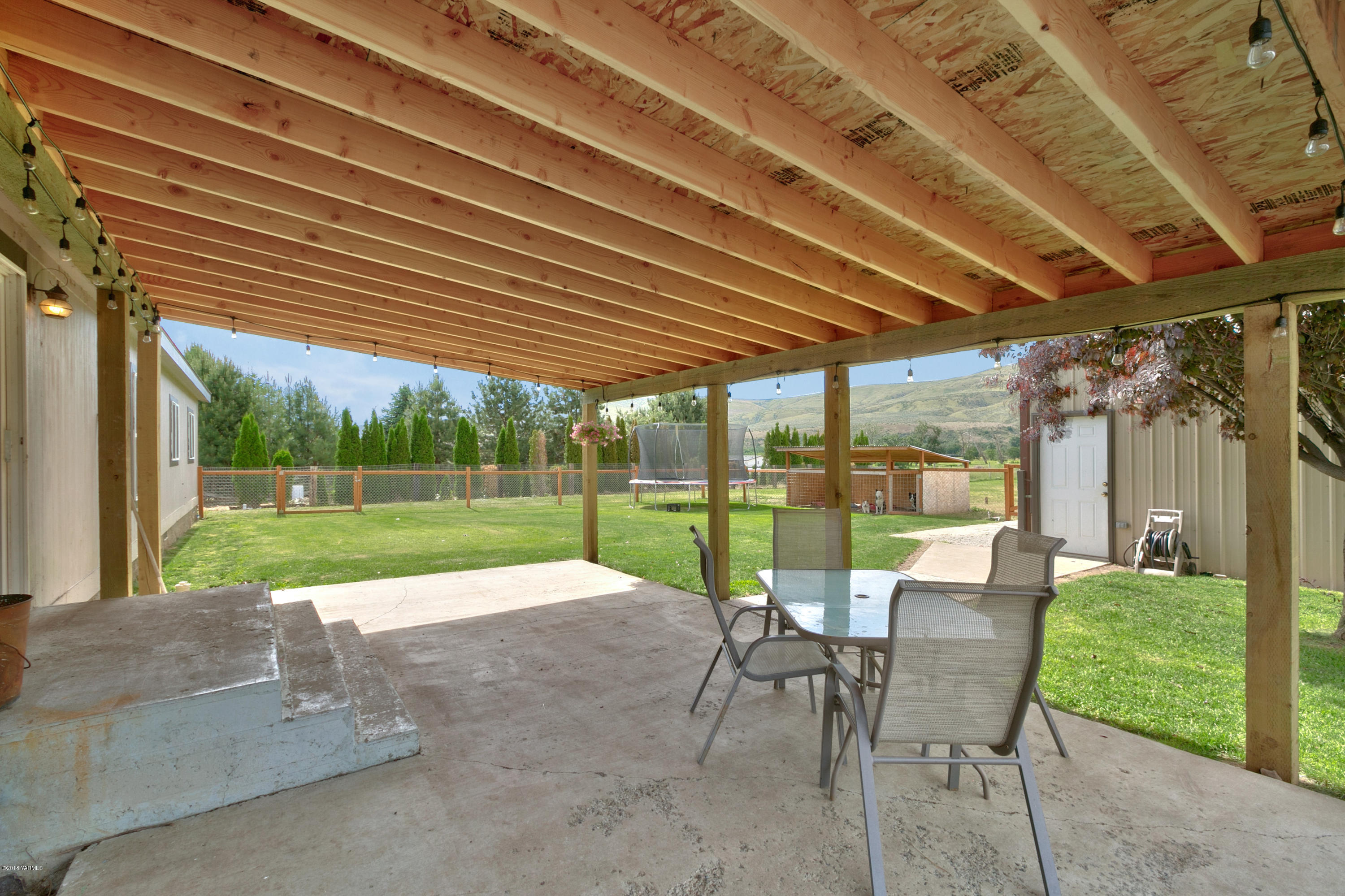 22490 Ahtanum Road Yakima, WA 98903 - Photo 15 of 20 a view of a backyard with sitting area