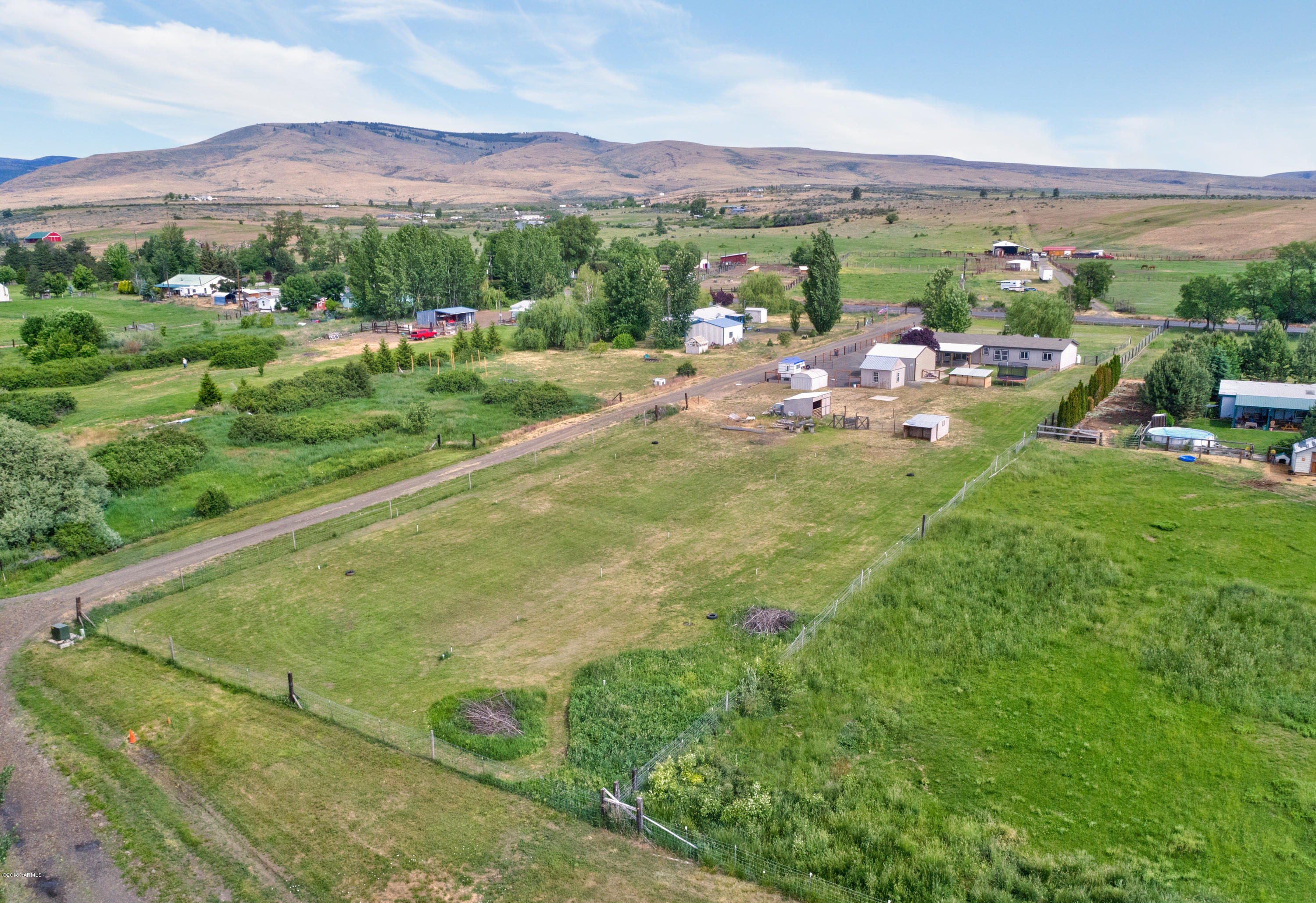 22490 Ahtanum Road Yakima, WA 98903 - Photo 19 of 20 a view of a lush green hillside and houses
