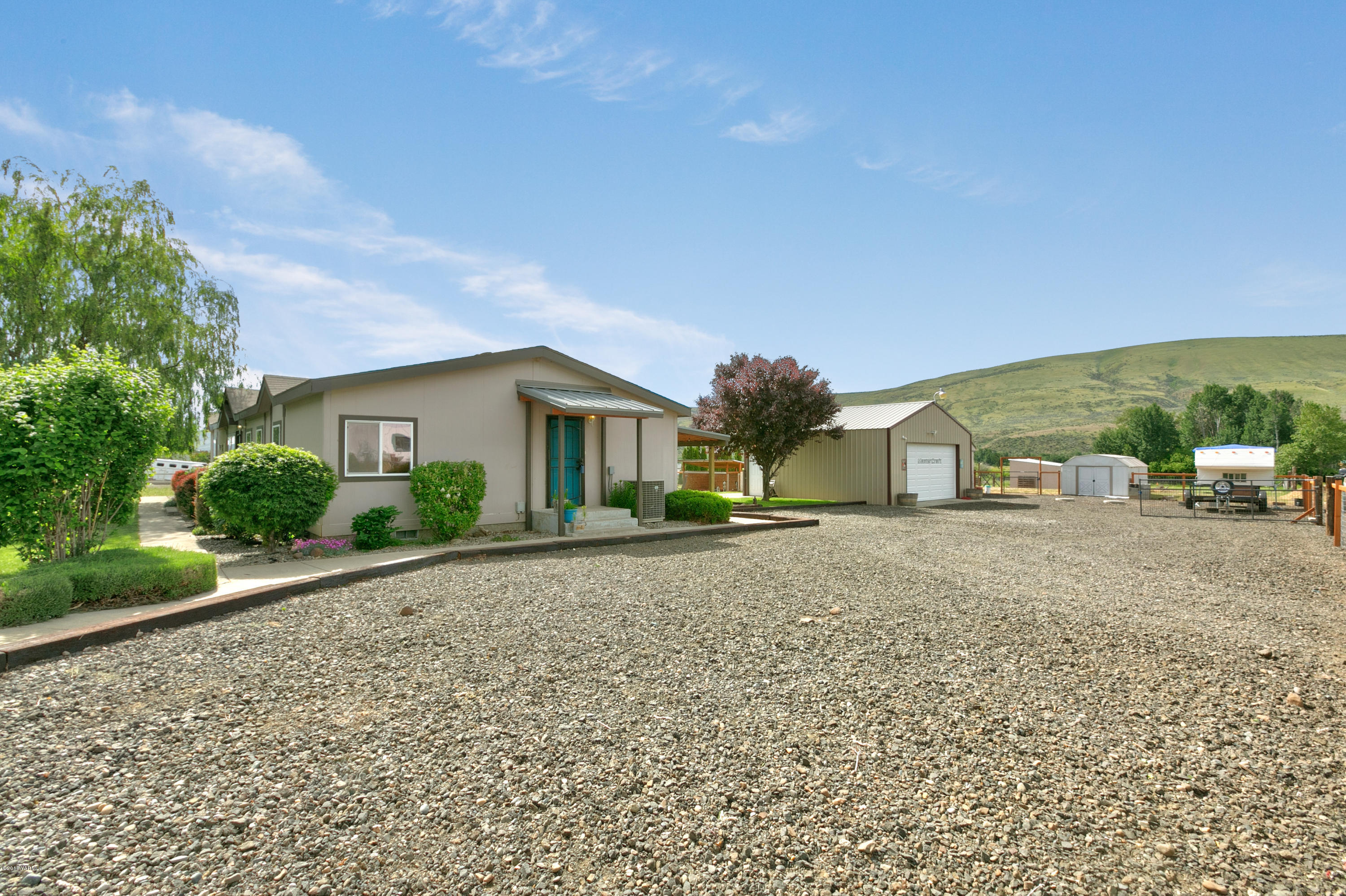 22490 Ahtanum Road Yakima, WA 98903 - Photo 20 of 20 a front view of a house with a yard and garage