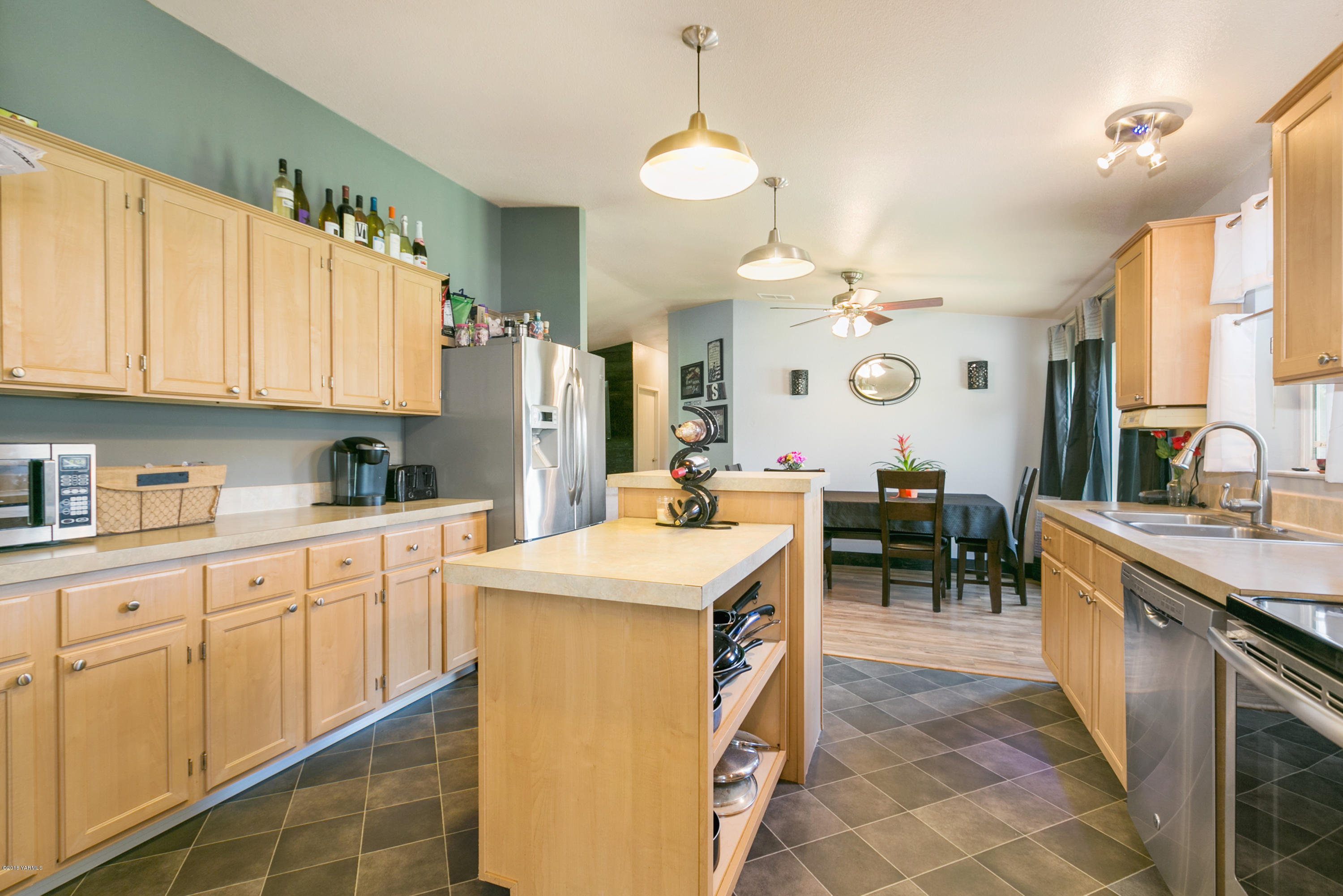 22490 Ahtanum Road Yakima, WA 98903 - Photo 5 of 20 a kitchen with cabinets a sink and appliances